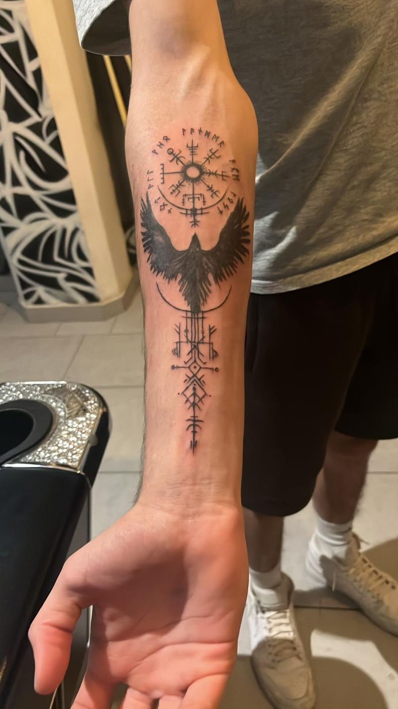 Blackwork Norse forearm piece: a vegvisir compass above a raven in flight and bindrune staves